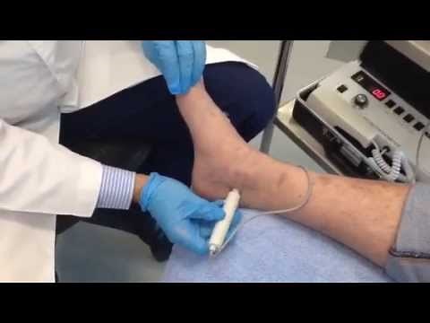 Dr Sami performing an arterial Doppler - Dubai Podiatrist