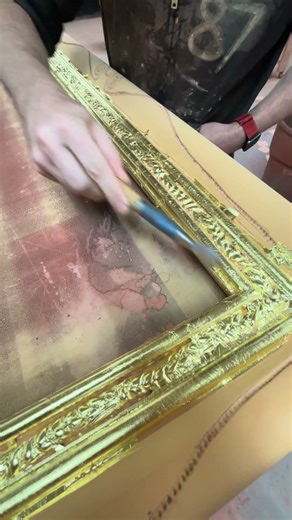 Gilding and burnishing a frame.