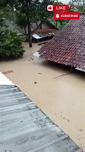Massive floodwaters are reaching the roofs in Cijayanti, Babakan Madang, Bogor Regency, We..