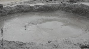 Gas bubbles coming out a mud volcano