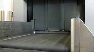 Airport baggage belt with moving luggage