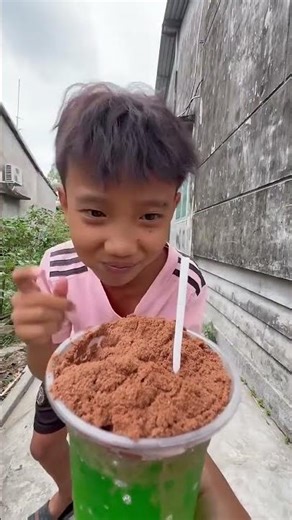 A cup of brown ice cream and two lollipops #shorts