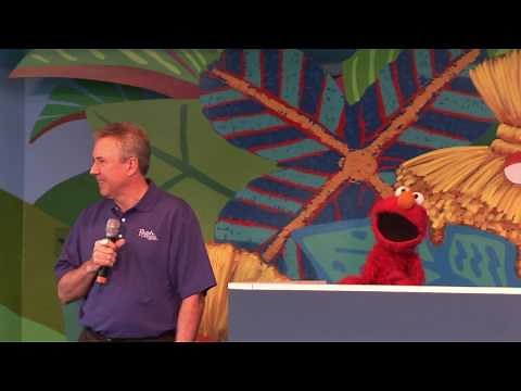 Elmo helps the Busch Gardens general manager open Sesame Street Safari of Fun