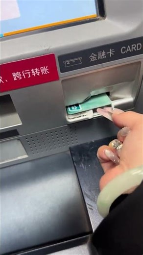 A Girl Struggling to Remove Her Card from the ATM Machine
