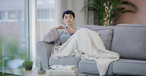 Phone, app and relax with bored woman on sofa in living room of home for thinking or vision. Contact, social media and communication with unhappy young person in apartment for mobile text message