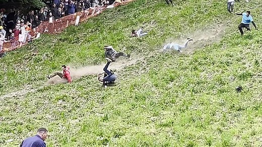 Daredevils hurl themselves down hill in Gloucester's famous cheese-rolling race