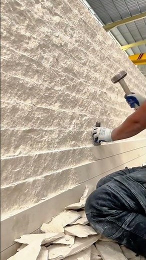 Stone surface shaping process using hammer and chisel for textured finish wall