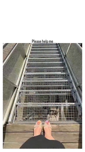 Lazy Legend on Instagram: "This viral video captures a woman in high-heeled sandals struggling to descend a metal-grated staircase, as the thin heels repeatedly catch in the gaps, emphasizing the impracticality of such footwear on industrial surfaces. Posted by @cyleshy on November 6, 2025, the clip has garnered over 8 million views and 31,000 likes, with replies blending humor—such as comparing it to Cinderella—and practical tips like removing shoes or toe-walking. The post taps into relatable 