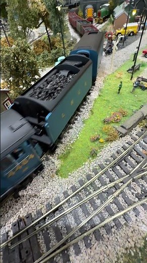 Bittern with two tenders pulling coal past the Invacar.