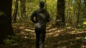 Running Men in Slow Motion. Caucasian Sportsman Taking Short Daily Jogging.