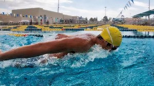 For more videos focus on butterfly eye position, click here - https://gosw.im/2u9jsQK Sometimes teaching great butterfly means keeping the swimmer shallow rather than pressing deep. Why do it: A shallow press on butterfly can help to increase the rate by creating less amplitude in the stroke, plus it can help build the ability to breathe on every stroke. How to do it: 1 - Have the swimmer look slightly forward as the hands enter the water. 2 - When the body rises on the recovery of the stroke, h
