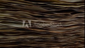 Ancient parchment papers rotation on the wood table, old weathered burnt textured paper stockpile supply. Paper for calligraphy memoir records and book making. Selective focus.