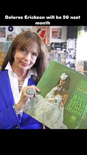 Dolores Erickson was the woman who was on the cover of Herb Alpert & the Tijuana Brass album “Whipped Cream & Other Delights” in 1965. Probably the top most popular/famous album cover in history.. She was 30 years old at the time and is still with us today closing in on 90 in 2025. Dolores Erickson (born September 1935) is an American model and artist. She came to prominence by appearing as a model on a number of album covers, most notably Whipped Cream & Other Delights (1965) by Herb Alpert and