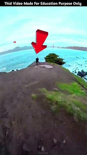 The boy saw a couple while carrying a bicycle.