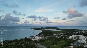 fajardo puerto rico aerial drone footage flying towards seven seas beach (tropical island getaway sunset dusk) hotel town city coast coastal shore travel getaway luxury torism