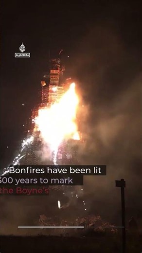 Anti-migrant display set alight in Northern Ireland bonfire