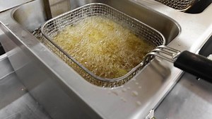 French fries frying in a deep fryer