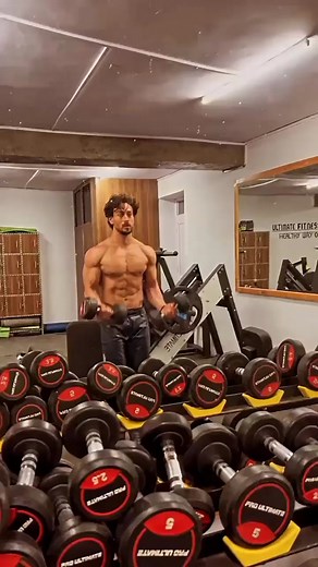 Weekend Motivation: Tiger Shroff shows off his ripped muscles and nails dumbbell bicep curls, watch #tigershroff #workout #gym #weekend #actor