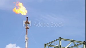 Fire on flare stack at oil and gas central processing platform release over pressure from process. Petroleum refinery plant