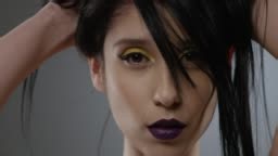 Beautiful woman face close up studio. Fashion Video. Slow Motion. 4K...