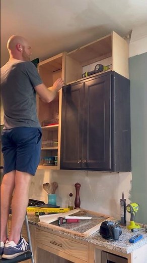 Installing the upper upper cabinets of our #kitchenrenovation. #diyhome #kitchenremodel