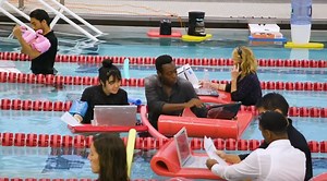 With Water Cooler & Floating Desks, Check Out The Pool Office (Video)