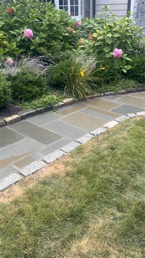 Fresh upgrade 🔥 New bluestone walkway finished with Belgian block edging for a sharp, high-end look that boosts curb appeal and durability. ✔️ Built right ✔️ Built to last Top Tier Paving & Masonry #mainlinecommunity #paving #Masonry #bluestone #WalkAway #patio | Top-Tier Paving & Masonry
