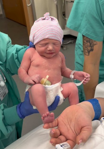 Baby's First Kiss with Mama - A Heartwarming Moment