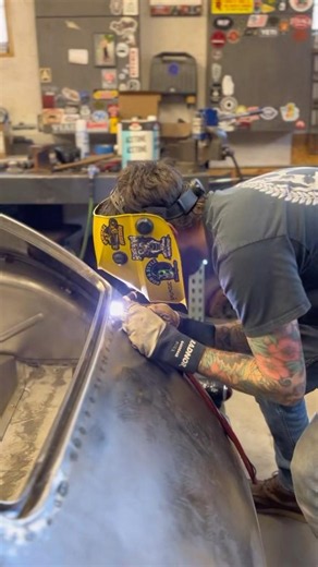 Tacking and planishing the trunk gutter and lead seam delete before the final weld
