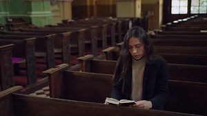 Prayer in the church. A lonely woman came to a Catholic church