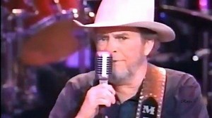 Mondays With Merle: Swinging Doors. This old smoke filled bar is something I'm not used to But I gave up my home to see you satisfied And I just called to let you know where I'll be living It's not much but I feel welcome here inside And I've got swinging doors, a jukebox and a bar stool And my new home has a flashing neon sign Stop by and see me any time you want to 'Cause I'm always here at home till closing time I've got everything I need to drive me crazy And I've got everything it takes to 