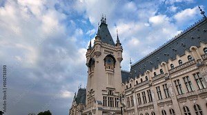 Urban landscape featuring the Palace of Culture in Iași with dynamic cloud movement