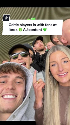 Celtic Players Celebrate with Fans at Ibrox