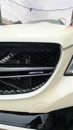 This is the Mercedes-Benz GLE63 S Coupe 2017. 577 horsepower. 0–60 mph in 4.1 seconds. AMG performance exhaust with that deep V8 crack. AMG RIDE CONTROL air suspension that lowers at high speed for better stability. 22-inch AMG cross-spoke wheels for real road presence. Clean white exterior. Cream leather interior. Panoramic roof that opens up the whole cabin. Massage seats for long drive comfort. Heated and cooled cup holders. Handcrafted AMG steering wheel. 360-degree camera for effortless par