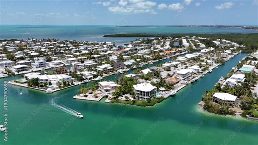 Boats navigating Snake Creek at Plantation Key in Islamorada of the Florida Keys.