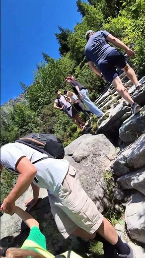 Climbing the glacial lake Czarny Staw pod Rysami. Part of the route to Lake Morskie Oko in Zakopane