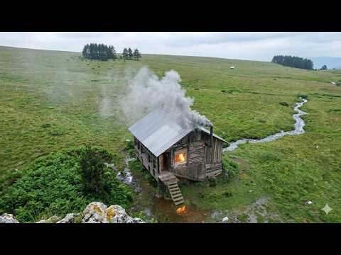hiding in an abandoned log cabin from the rain , no one has lived here for 50 years