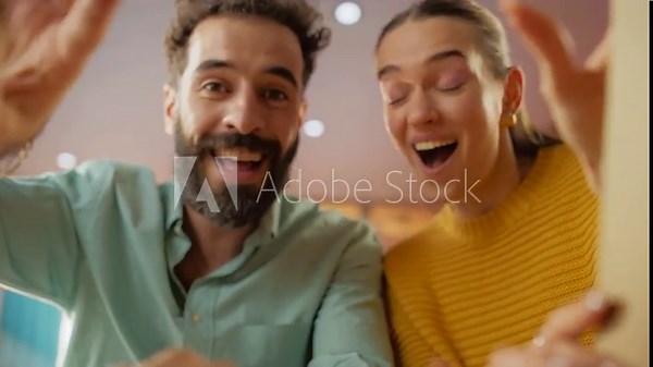 POV From Inside Box: Portrait of Man and Woman Receiving and Opening Parcel at Home. Enthusiastic and Expressive Couple Receiving a Surprising Gift for Their Wedding. Slow Motion