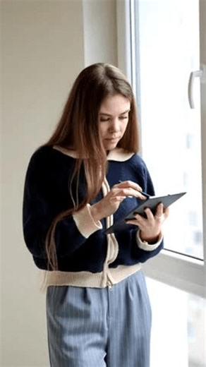 clip-4042867761-young-female-interior-designer-working-on-digital