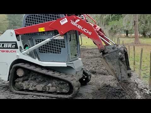 Takeuchi TL8R2 compact track loader grading