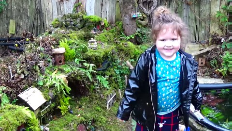 Evie in the mouse garden . She loves to see the mice and give grandad a hand feeding them . | George the Mouse in a log pile house
