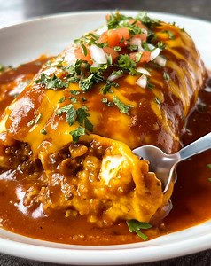 Hearty, cheesy, and smothered in flavor! 🌯🔥 This Ground Beef Wet Burrito is packed with seasoned beef, rice, and beans, then topped with rich enchilada sauce and melted cheese — the ultimate comfort-food feast! 😍 .............. Full Recipe in Coʍmеոτ 💬👇 | Recipes with Me