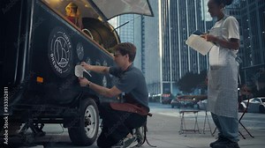 Small Business Owners Setting up a Food and Coffee Stand in a Busy City Street, Collaborating on Branding, Decorating Counter with Stylish Stickers. Male and Female Team Working in Good Spirit