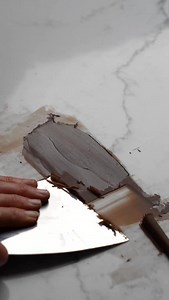 Choc shards part two! I am sure you have seen these on most boutique bakery cakes- and they are so easy to make! The key is to make sure the chocolate is JUST set but not quite set, and then glide over the top with a bench scraper that is almost flat against the bench. I found that angling the scraper upwards resulted in straight shards that didn’t curl up like I wanted. #chocshards #chocolateshards #chocolateart #chocolate #cakedecorating | Rosie's Dessert Spot