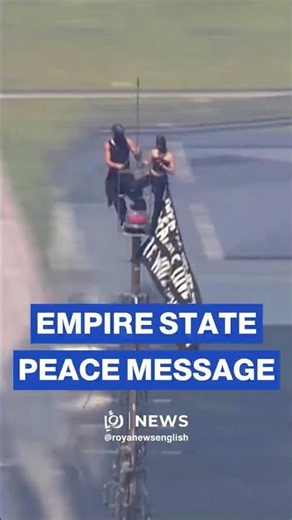 Two climbers unfurl peace banner atop of Empire State Building