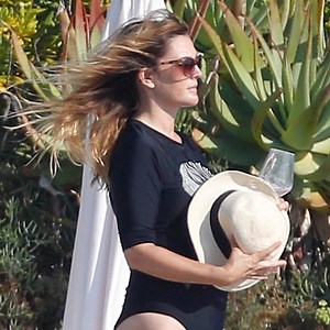 Drew Barrymore Wears Black Swimsuit during European Vacation—See the Photos!