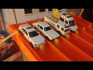 Racing 4 of 5 vehicles from the MBX Rescue 1 five pack from Matchbox down Napation Speedway.