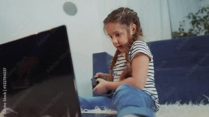 little girl playing video game on gamepad. kid dream stay home computer addiction. girl playing tablet video online games. addiction to online games addict kid. child play game dream fun