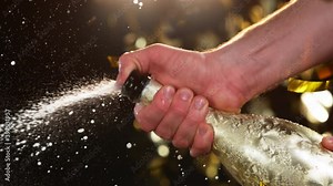 Super slow motion of Champagne explosion, opening champagne bottle closeup. Filmed on high speed cinema camera, 1000fps
