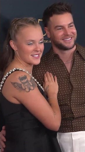 JoJo Siwa and Chris Hughes Smooch On Red Carpet!